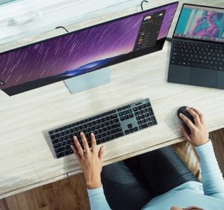 person using laptop on table