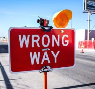 red Wrong Way signage on road