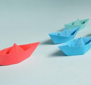 Paper Boats on Solid Surface