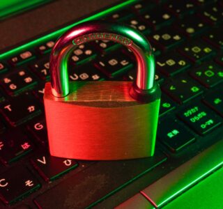 red padlock on black computer keyboard