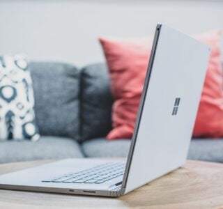 macbook pro on white couch