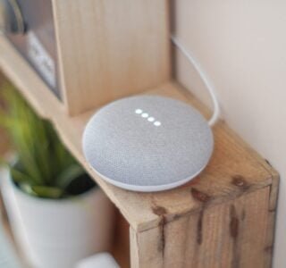 Free Round Grey Speaker On Brown Board Stock Photo