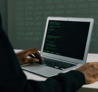 Free Person Using Macbook Air Stock Photo