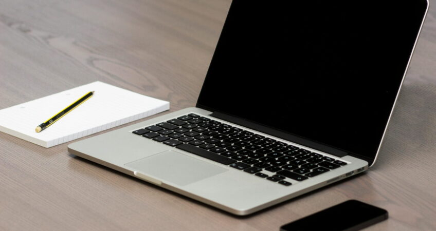 Free Silver Macbook Beside Iphone Stock Photo