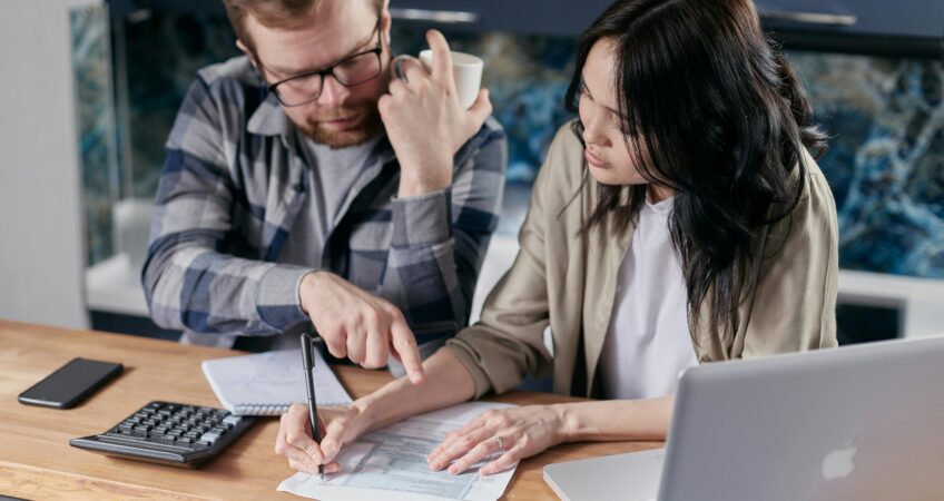 Free couple calculating al their bills stock photo