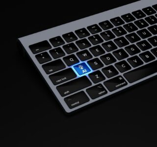 a black keyboard with a blue button on it