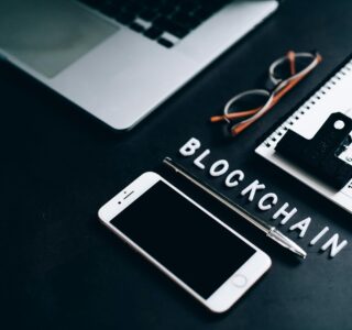 Free Flat lay of a modern digital workspace with blockchain theme, featuring a smartphone and calendar. Stock Photo