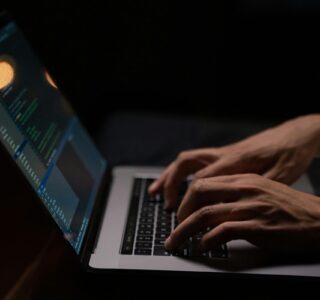 person-using-silver-and-black-laptop-computer