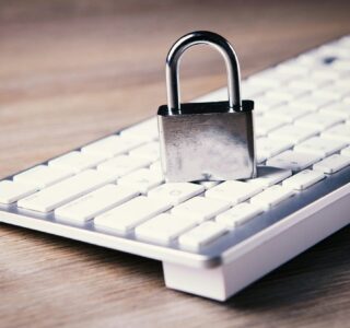 a computer keyboard with a padlock on top of it