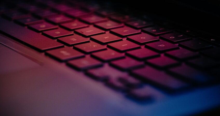 a-close-up-of-a-keyboard-with-a-blurry-background